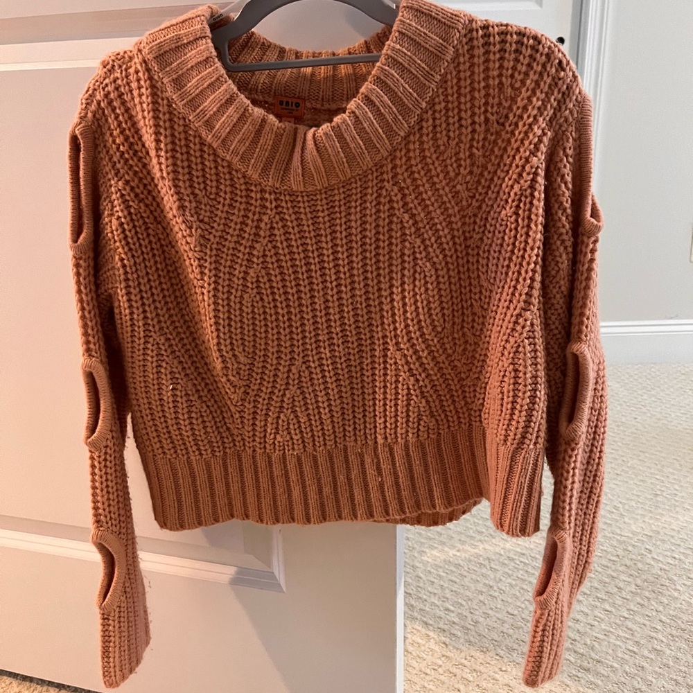 Peach sweater with arm holes detail